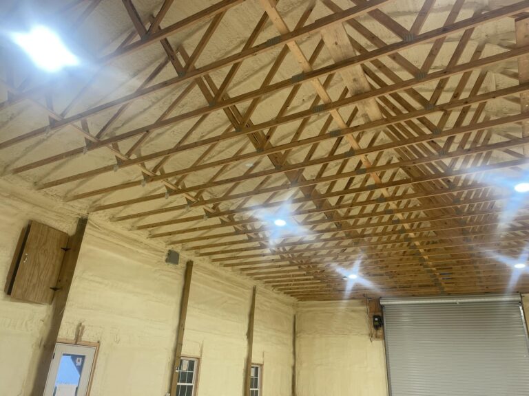 Interior of commercial building with spray foam insulation applied to walls and ceiling for energy efficiency